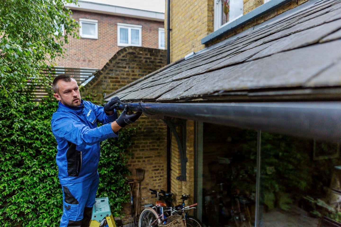 Guttering being worked on along a house roofline